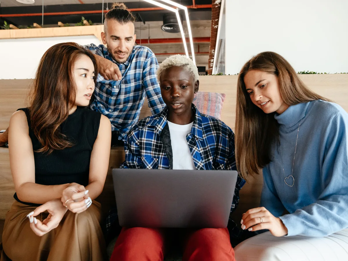 A diverse team of professionals collaborating on a project around a table.